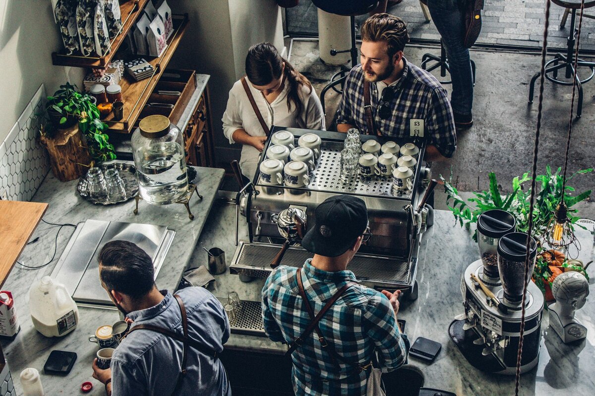 Customer paying for coffee at a cafe counter