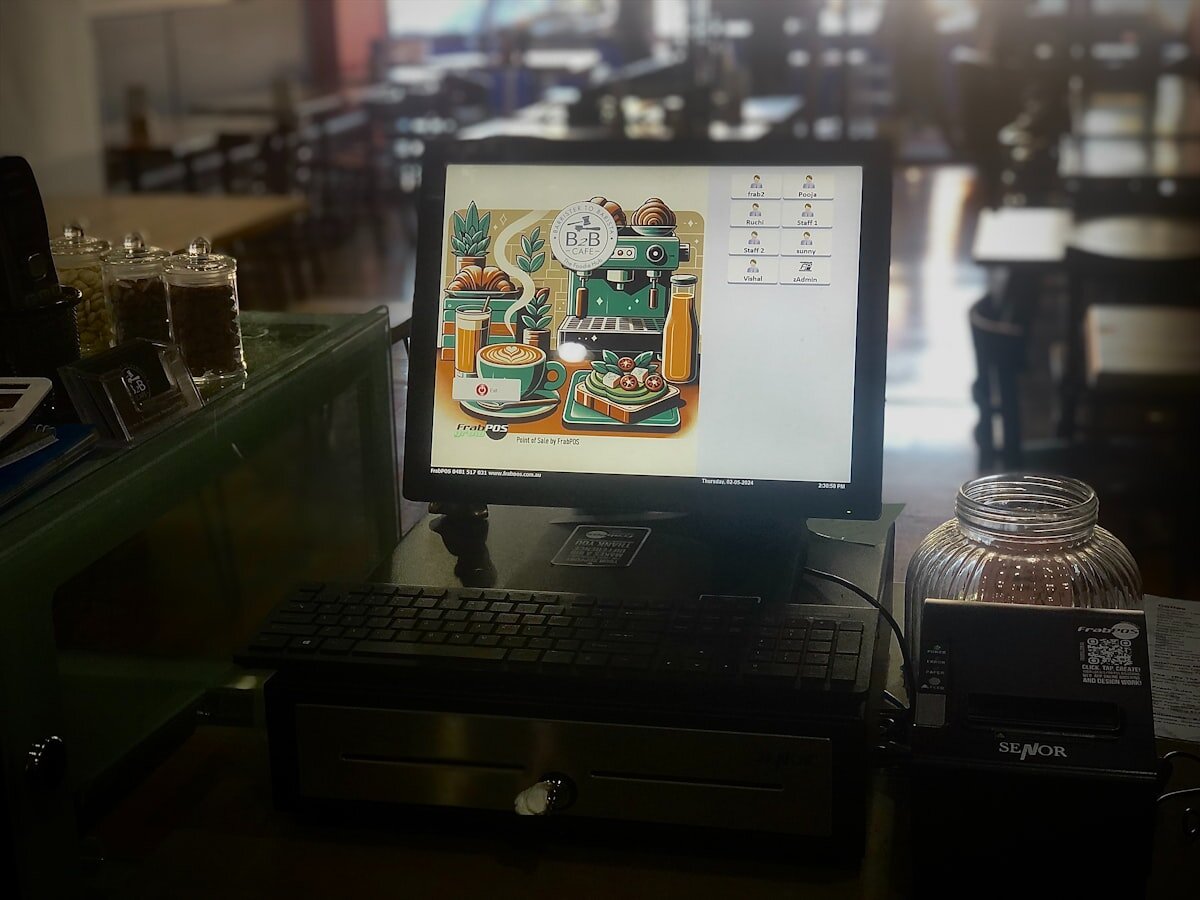 A loyalty card QR code shown at a coffee shop counter